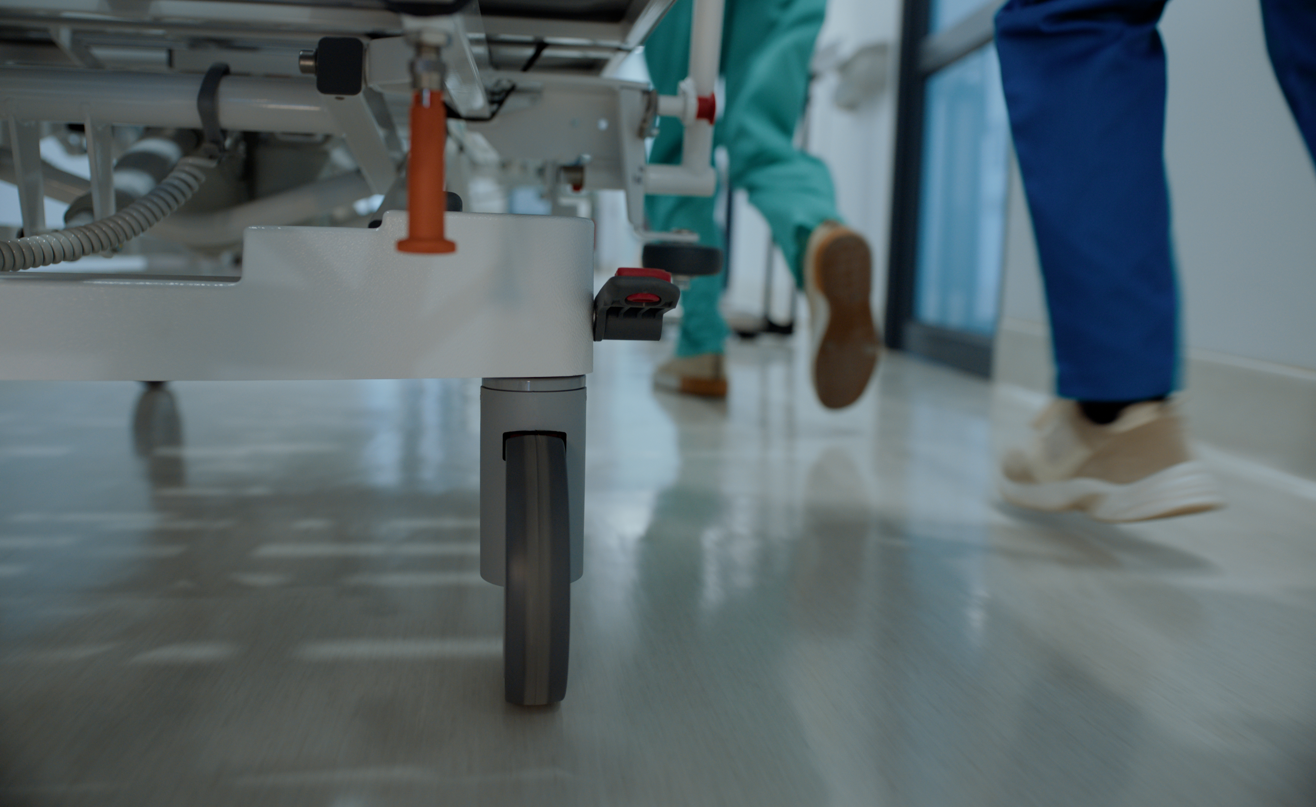 Emergency medical team rushing a patient on a stretcher through a hospital corridor, illustrating urgent care, expert treatment, and the critical response following serious injuries.