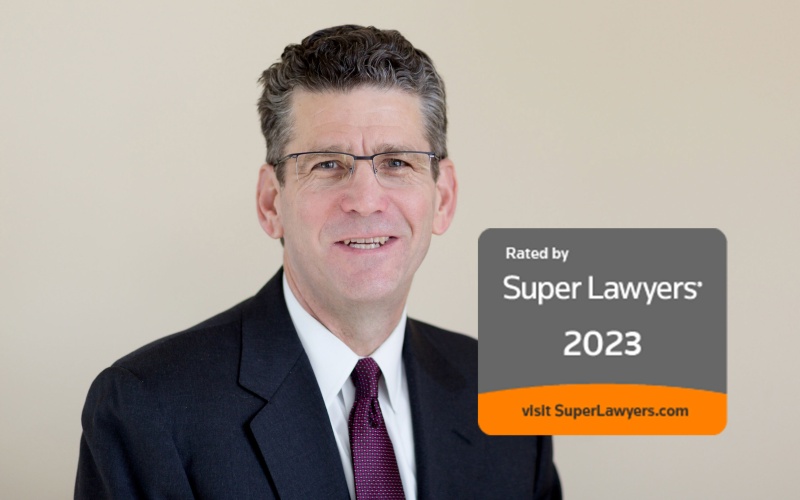 Doug Maynard Headshot with Super Lawyers 2023 Badge