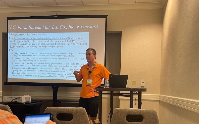 Doug Maynard presenting the 2021–2022 insurance law updates during a continuing legal education session at the NCAJ summer convention in Charlotte, NC.