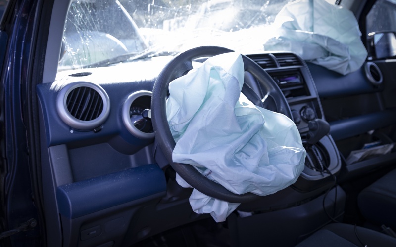 stock photo of a car that is is totaled, needing repair to demonstrate the insurance claim process