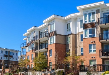 Simple apartment building on a sunny day with blue skies