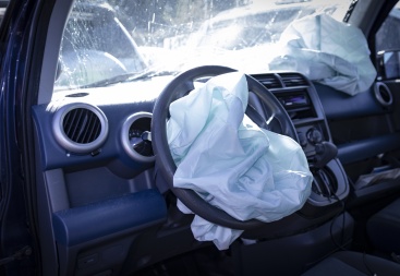 stock photo of a car that is is totaled, needing repair to demonstrate the insurance claim process