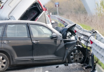 a car crashes on the side highway barrier